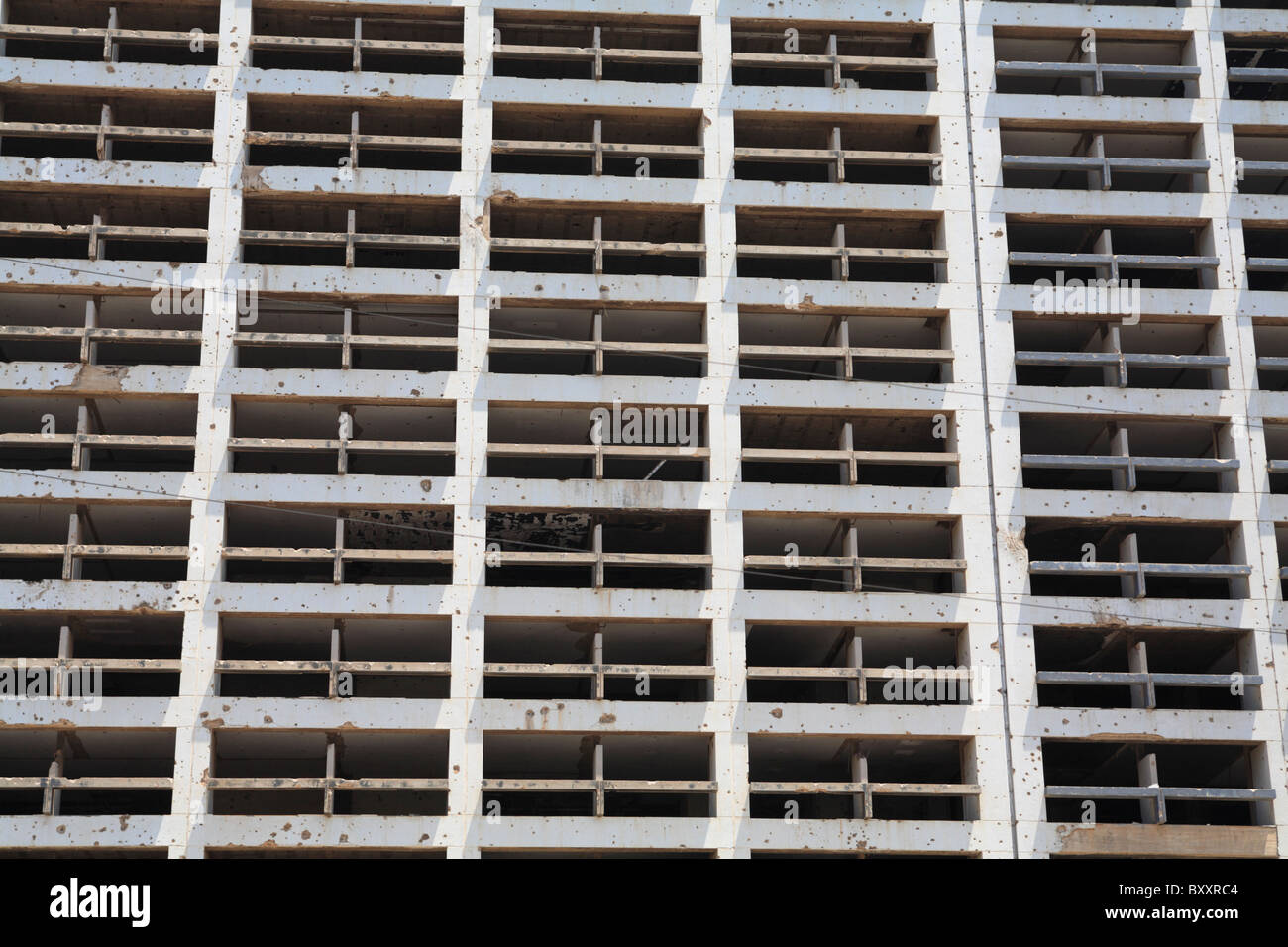 Detail of the still standing bullet ridden Holiday Inn hotel which was damaged during the civil war downtown Beirut Lebanon Stock Photo