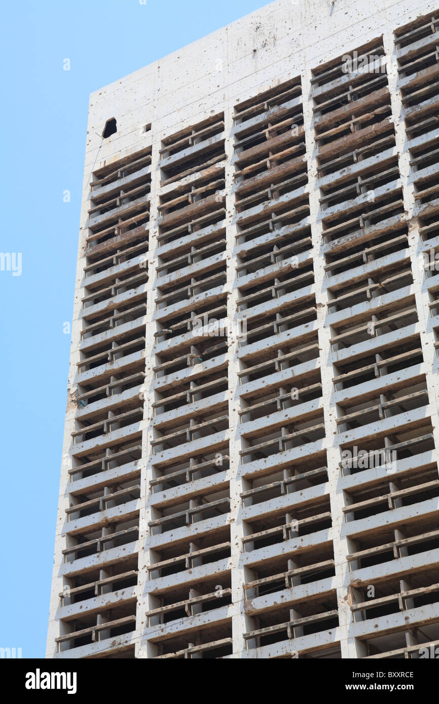 Detail of the still standing bullet ridden Holiday Inn hotel which was damaged during the civil war downtown Beirut Lebanon Stock Photo