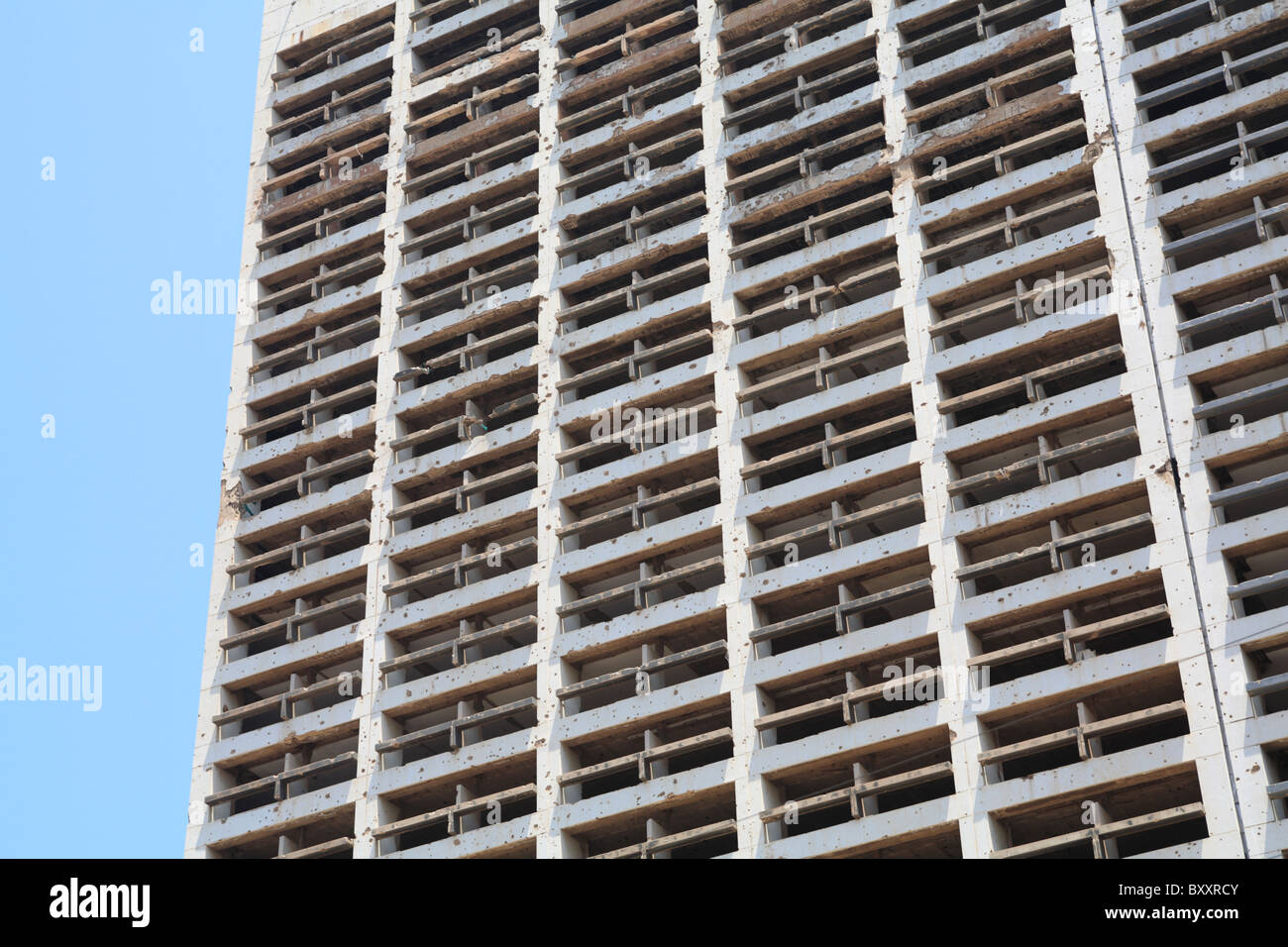 Detail of the still standing bullet ridden Holiday Inn hotel which was damaged during the civil war downtown Beirut Lebanon Stock Photo