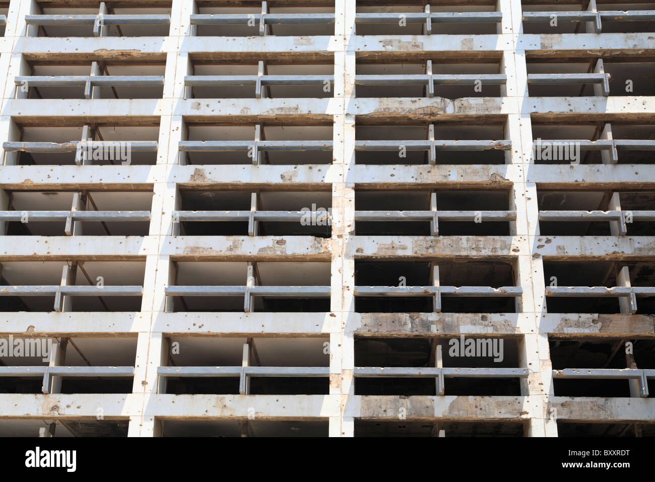 Detail of the still standing bullet ridden Holiday Inn hotel which was damaged during the civil war downtown Beirut Lebanon Stock Photo