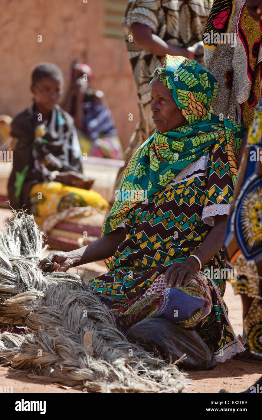 A woman sells rope in the weekly market of Djibo in northern Burkina Faso. Stock Photo