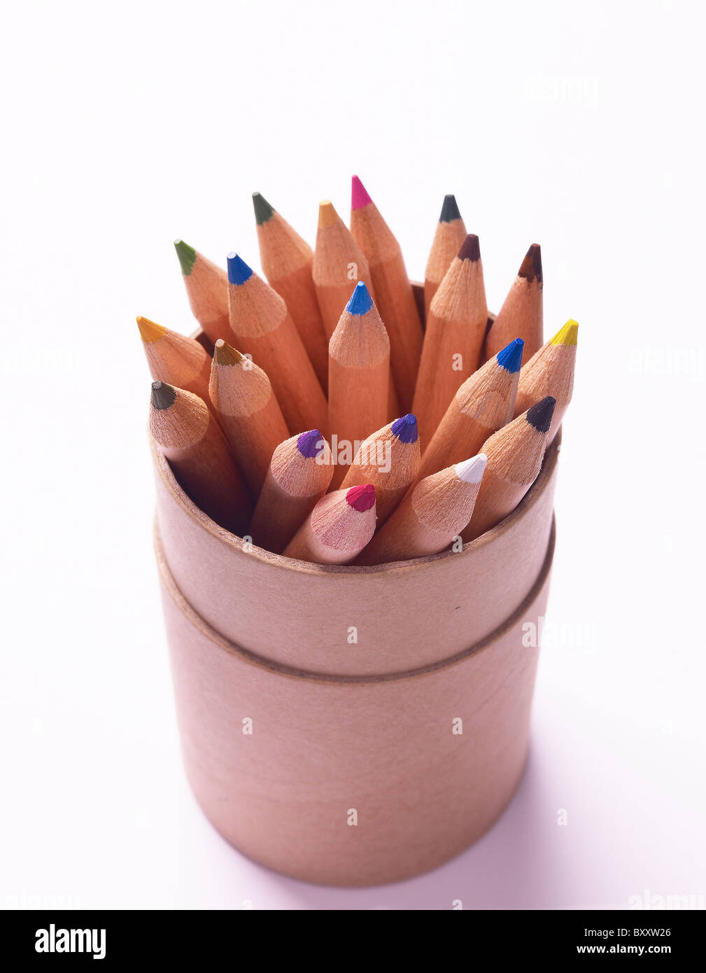 small coloured colored pencils coming out of a cardboard tubular box Stock Photo