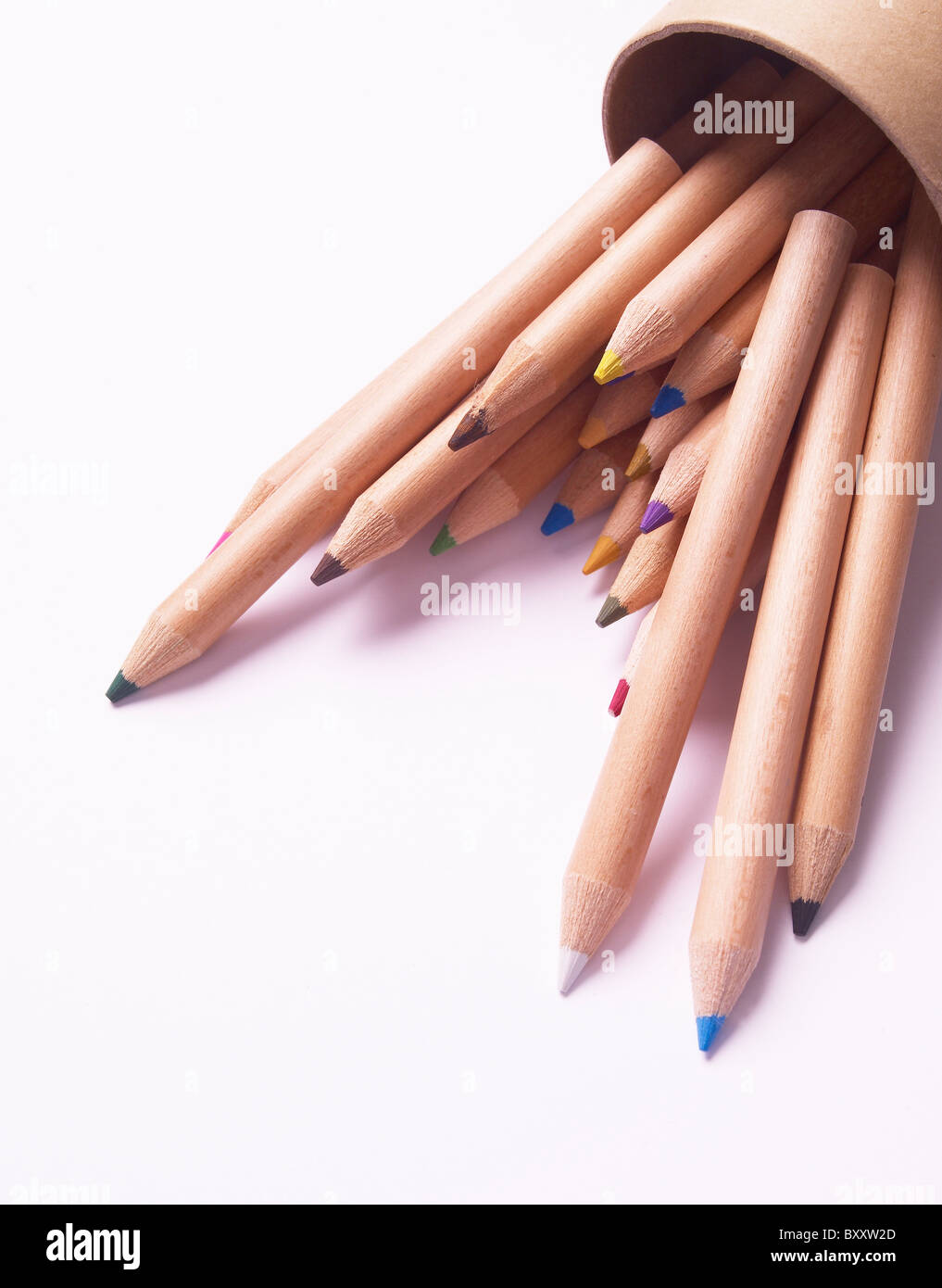 small coloured colored pencils coming out of a cardboard tubular box Stock Photo