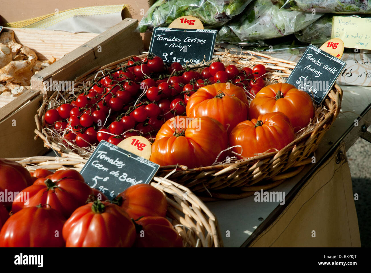 Baskets of tomatoes for sale at a French market Stock Photo - Alamy
