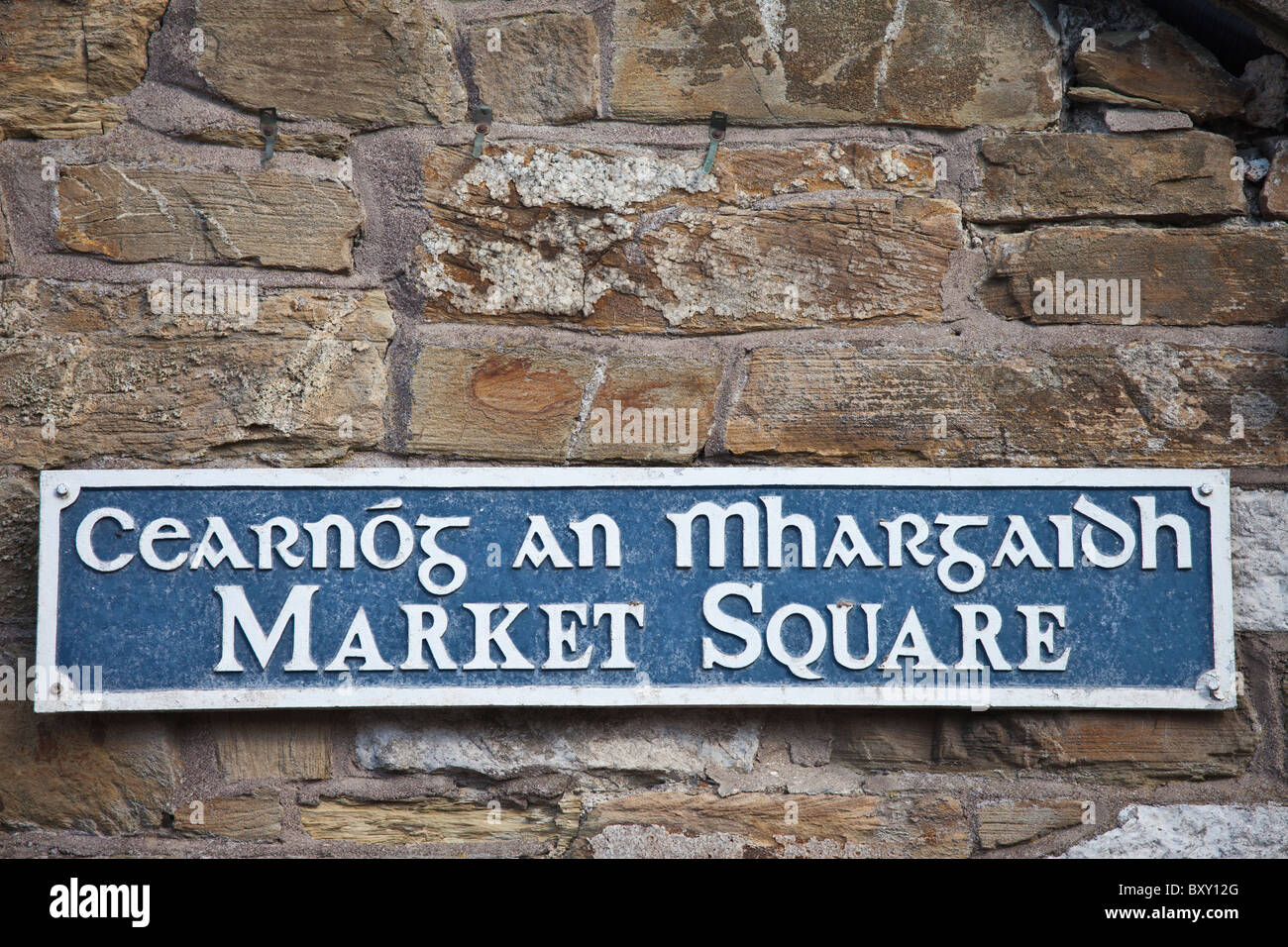Market Square sign in Gaelic and English in quaint traditional town of Youghal, County Cork, Ireland Stock Photo
