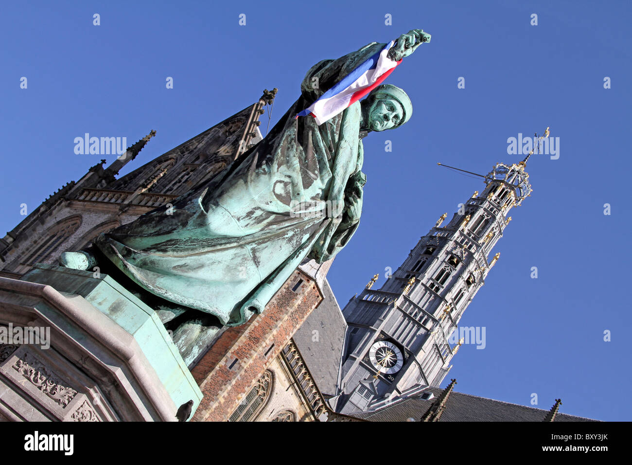 Statue of Laurens Janszoon Coster and the Grote Kerk or St. Balo Church in Haarlem, Holland Stock Photo