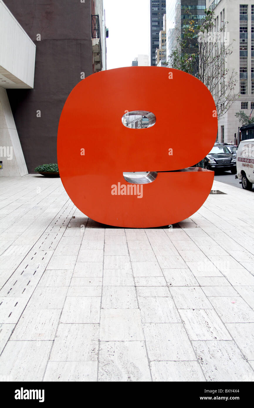 Giant red letter e, actually a big reverse number 9 in the street in New York, America Stock Photo