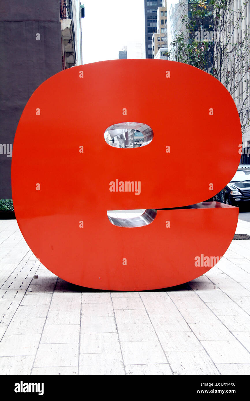 Giant red letter e, actually a big reverse number 9 in the street in New York, America Stock Photo
