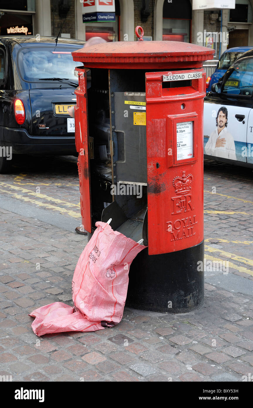 an open letter box having post collected from it Stock Photo Alamy