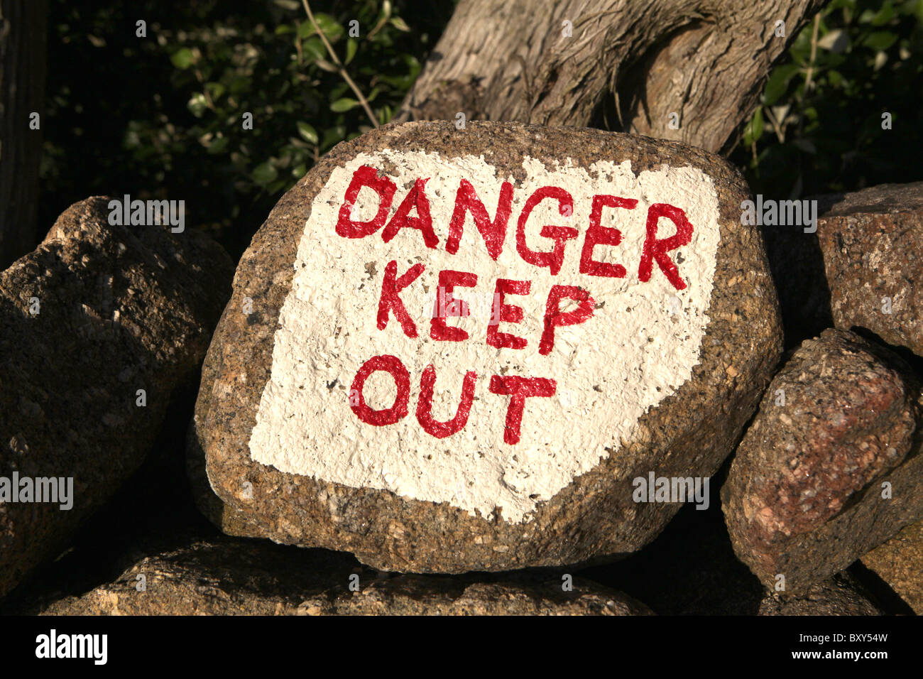 A stone painted with Danger Kepp out in Nanjulian, Penwith District , Cornwall, England. Stock Photo