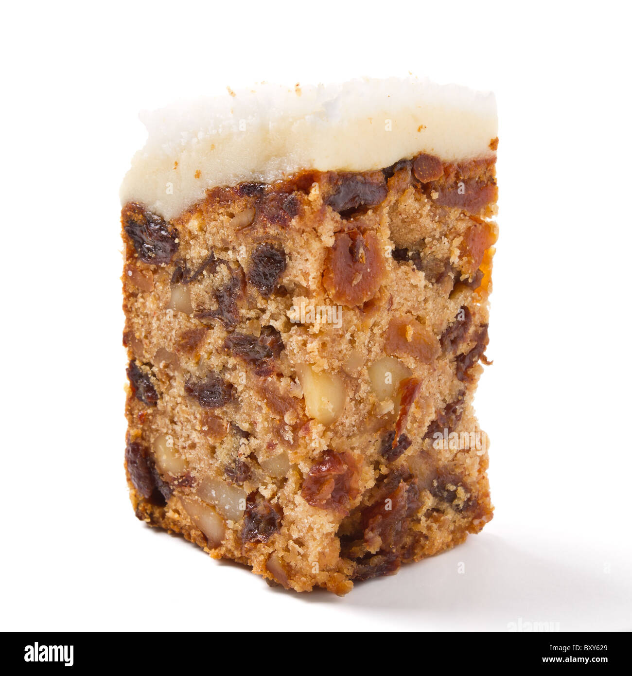 Last piece of Christmas cake from low perspective isolated on white. Stock Photo