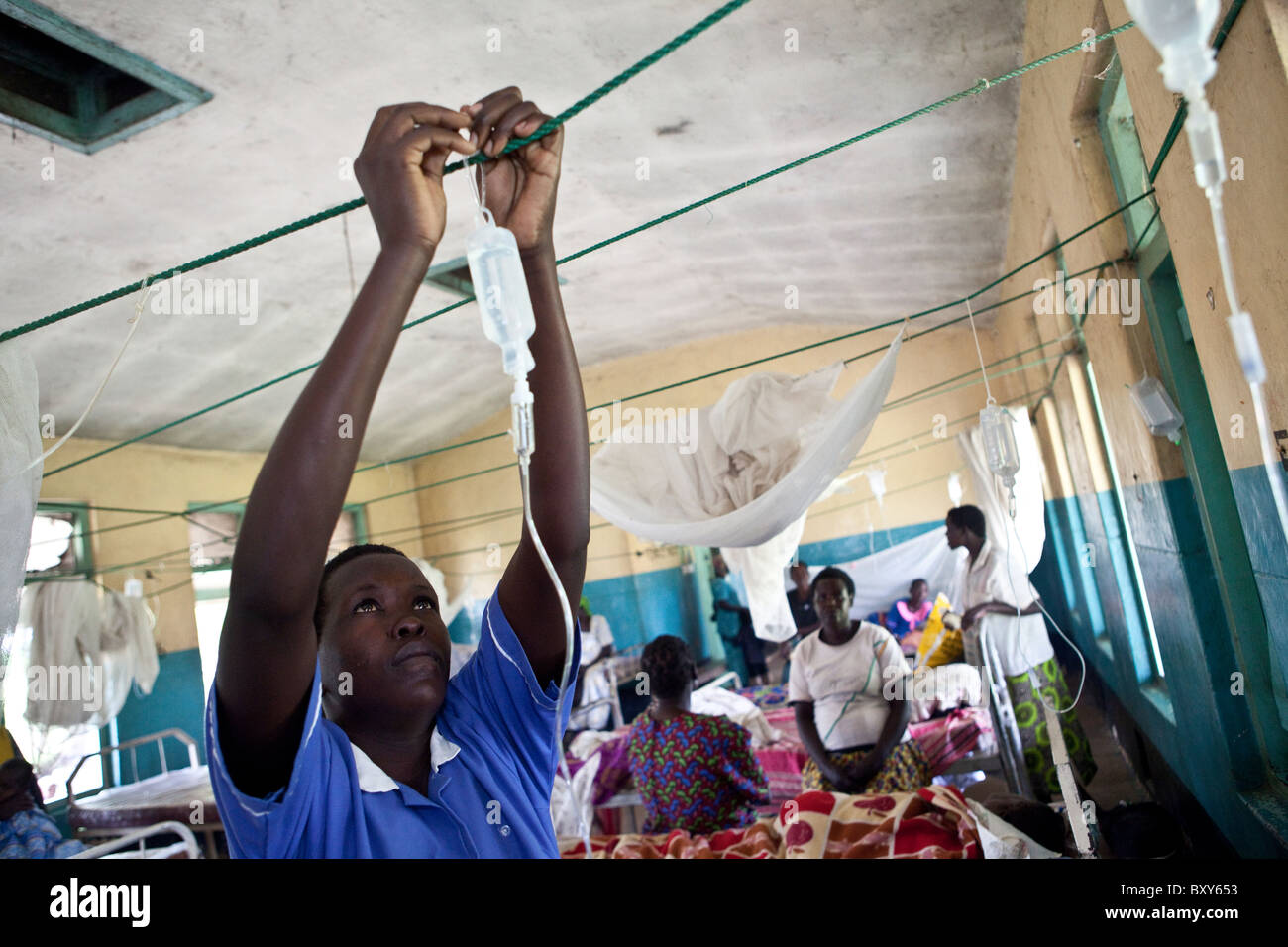 Nurse Jennifer Asio (22) cares for patients at Amuria Health Centre IV - Amuria District, Uganda, East Africa. Stock Photo