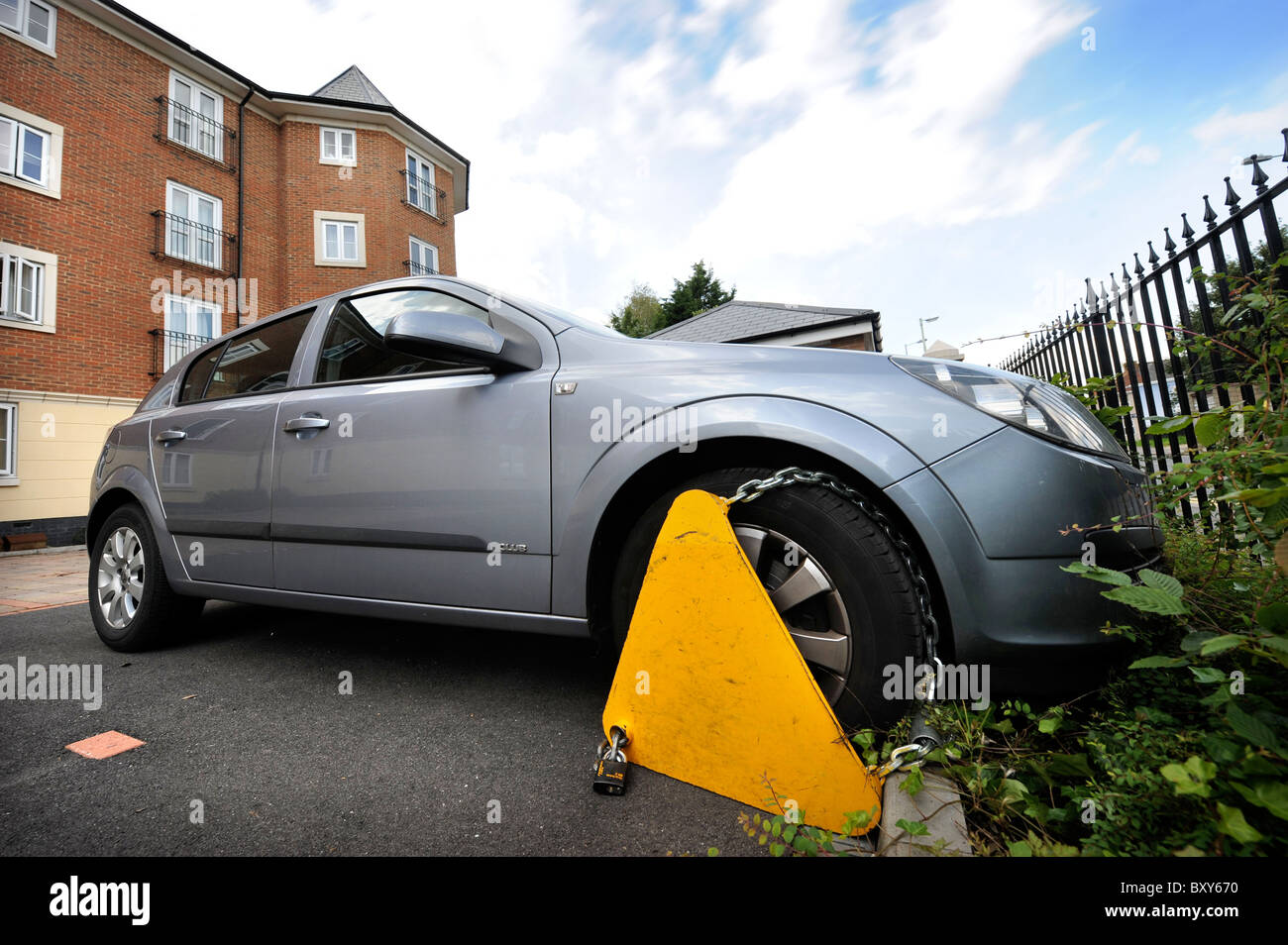 A clamped car parked in a residential area UK Stock Photo Alamy
