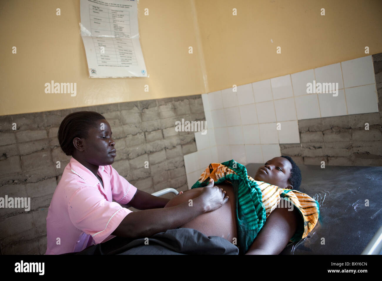 A nurse gives a maternal exam at Amuria Health Centre, Uganda, East Africa. Stock Photo