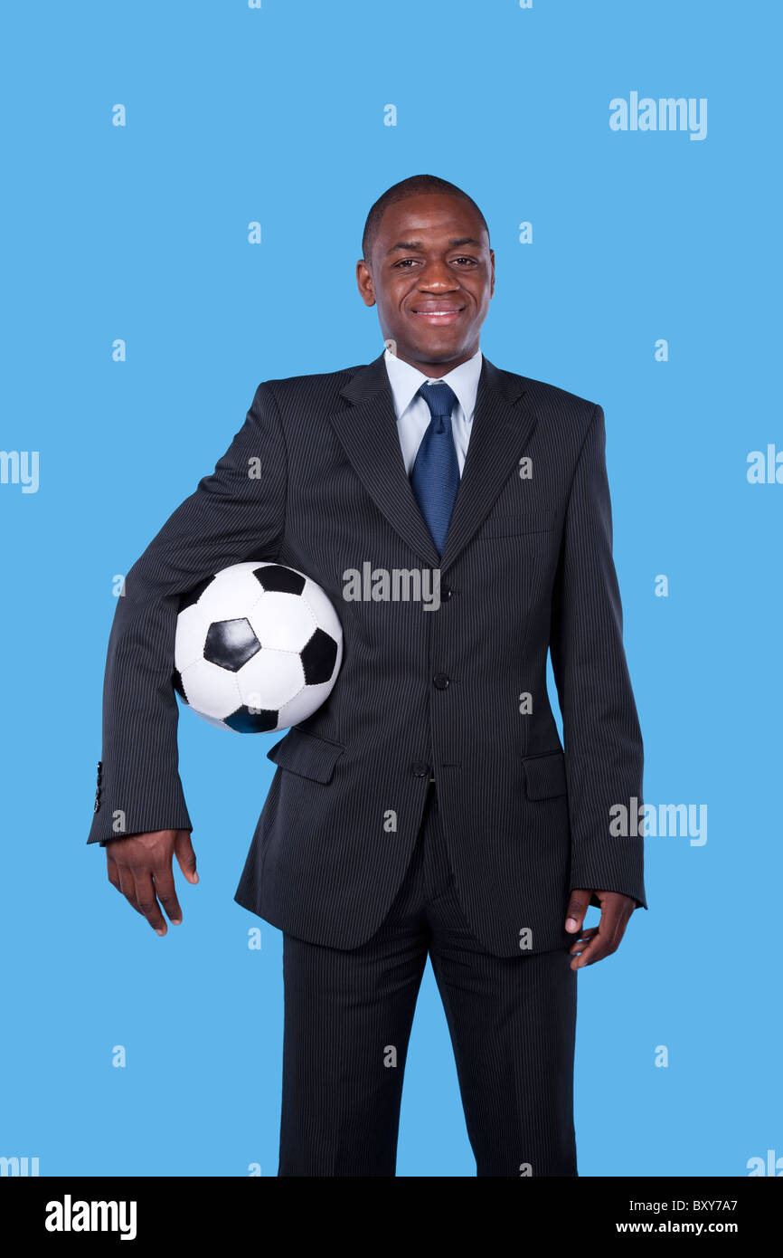 African businessman holding a soccer ball Stock Photo - Alamy