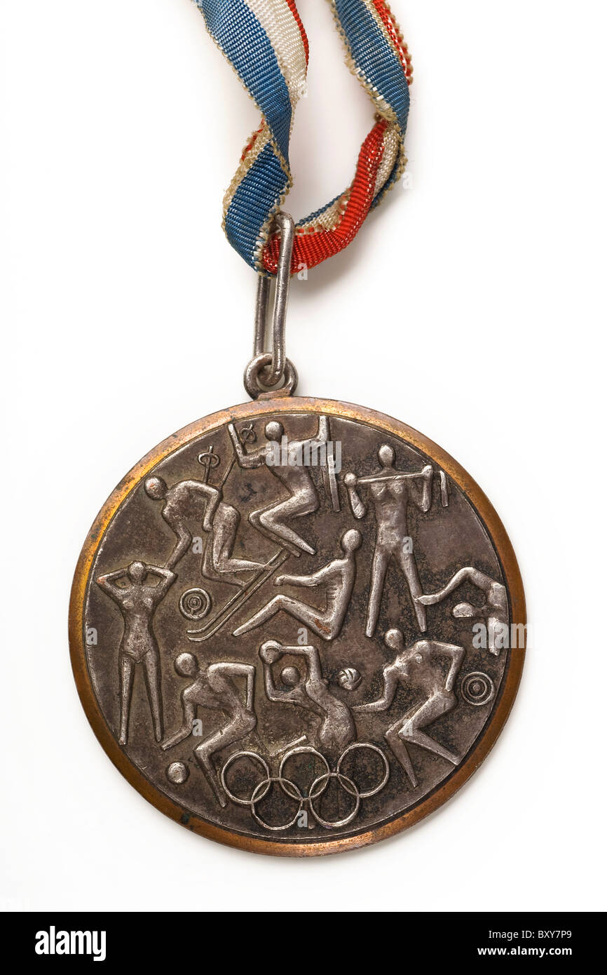 a closeup of an old olympic bronze medal on white Stock Photo