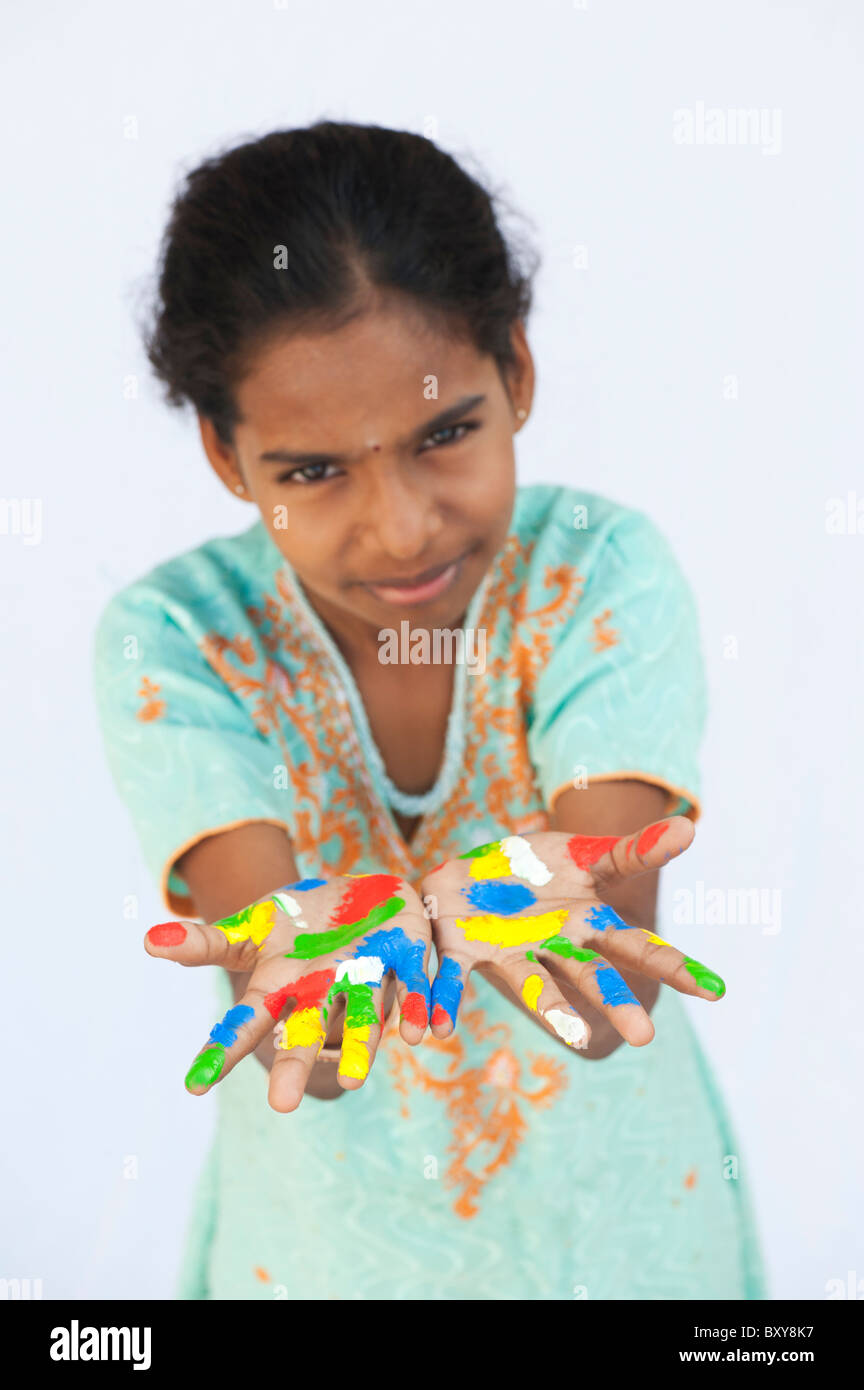 Indian Child Color Hand Young Indian girl with painted multicoloured hands against a white ...