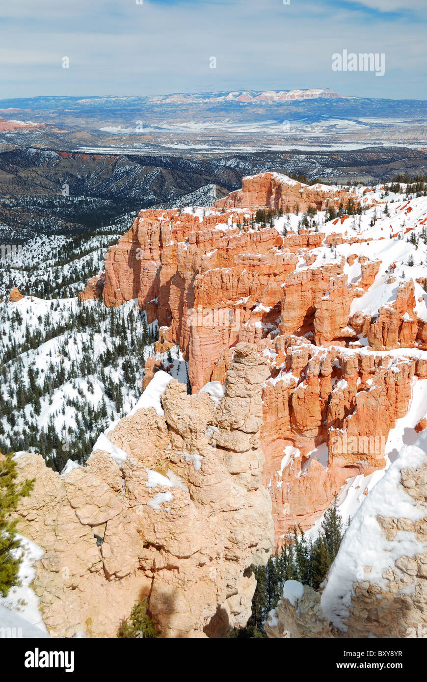 Bryce canyon panorama with snow in Winter with red rocks and blue sky