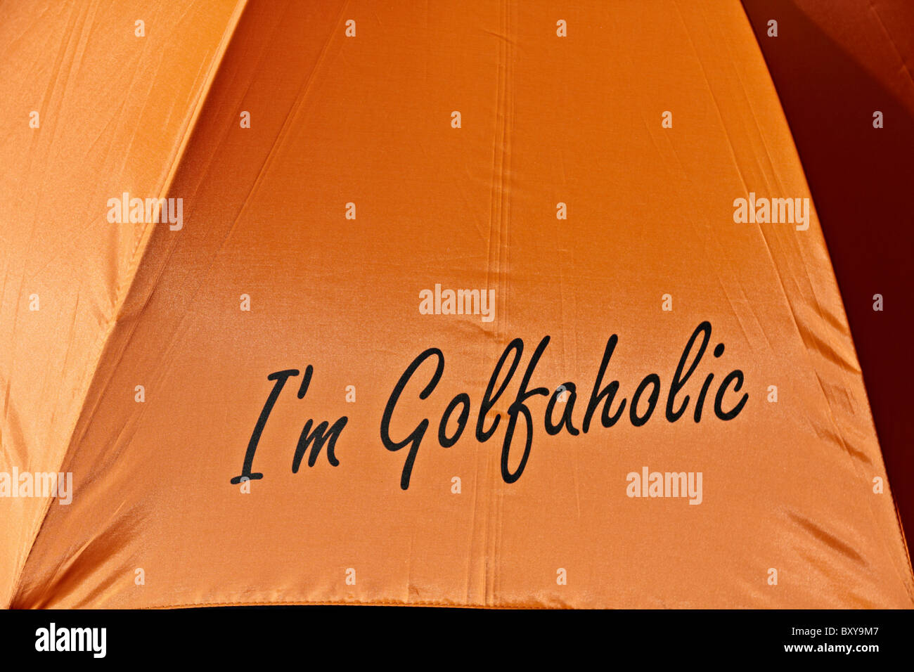 Golf umbrella. Appropriate statement on a golfers umbrella Stock Photo