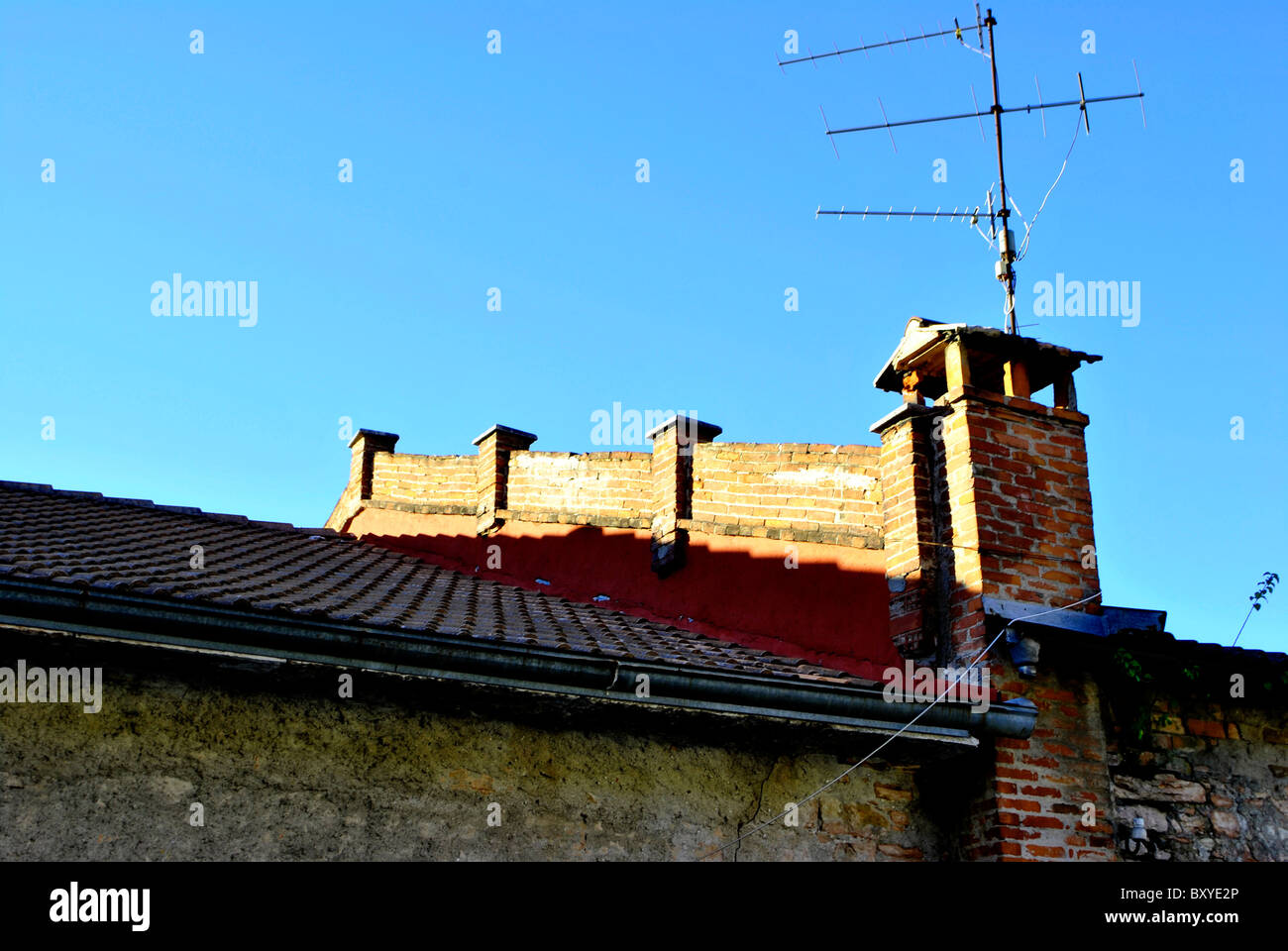 fireplace and roof with antennas for television Stock Photo