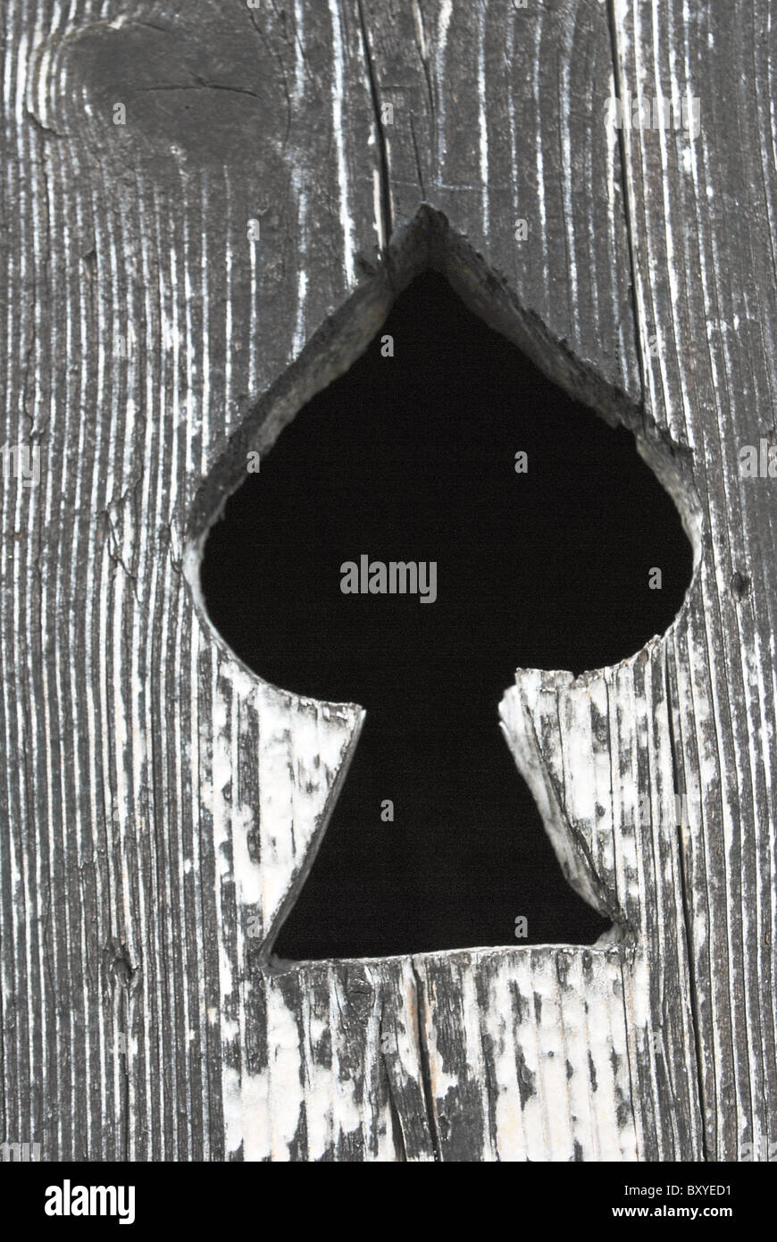 aged wood texture with a spadeshaped hole Stock Photo Alamy