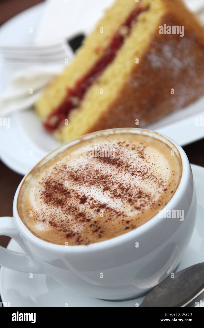 Abbeywood Garden, Cheshire. Angled close up view of coffee and cake being served at Abbeywood Garden cafe. Stock Photo