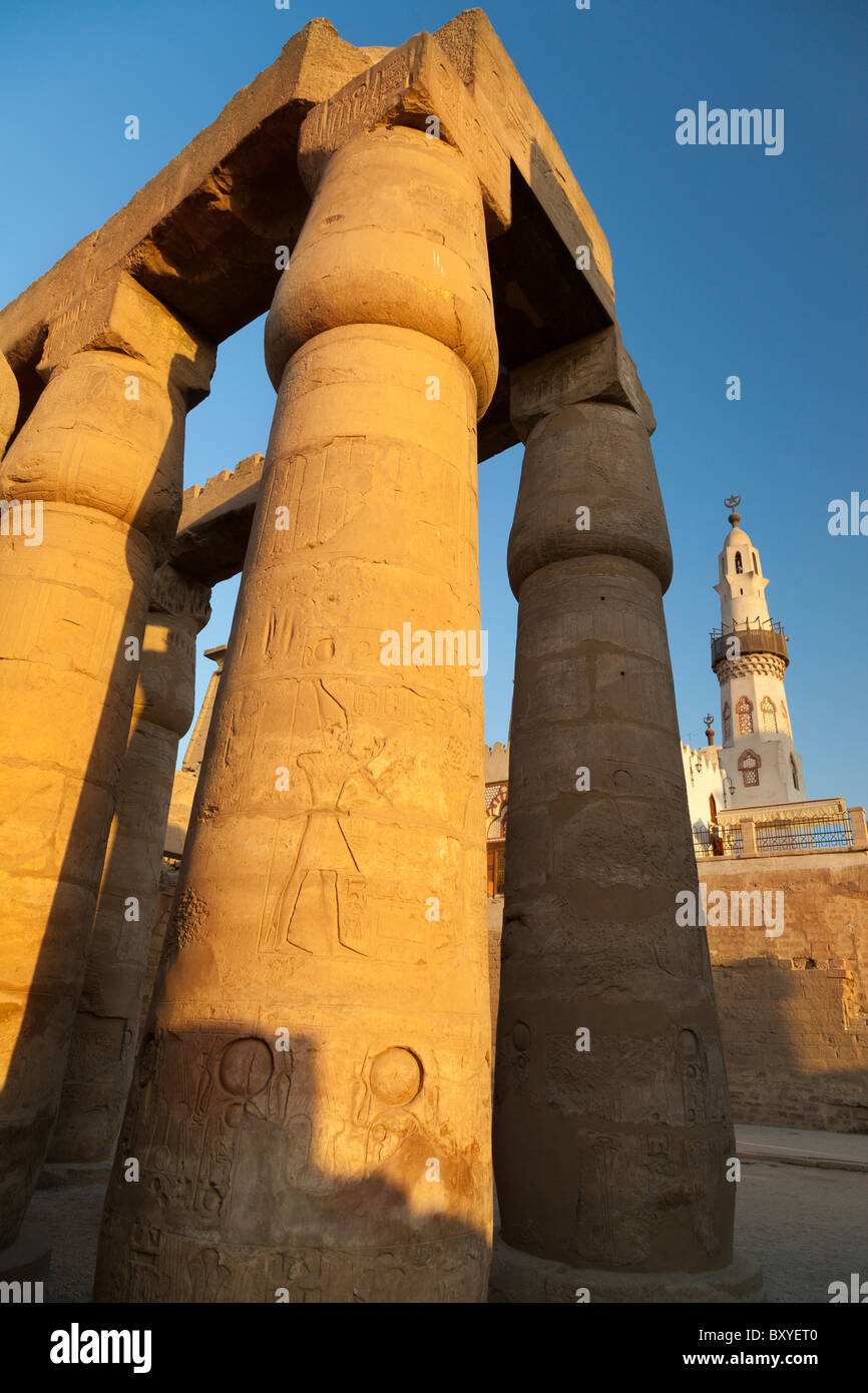 Luxor Temple, Egypt - pillars at sunset, triumphant minaret in background Stock Photo