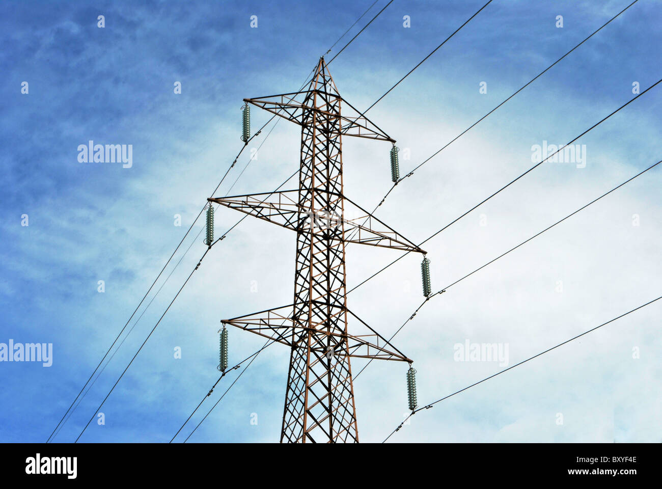 high voltage line and wires with blue sky with white clouds background ...