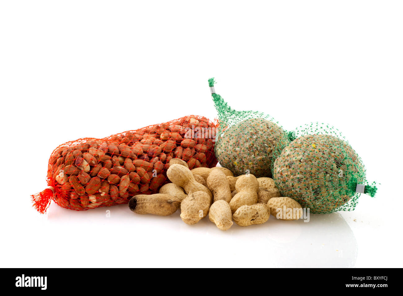 Feeding the birds in winter time with peanuts Stock Photo Alamy