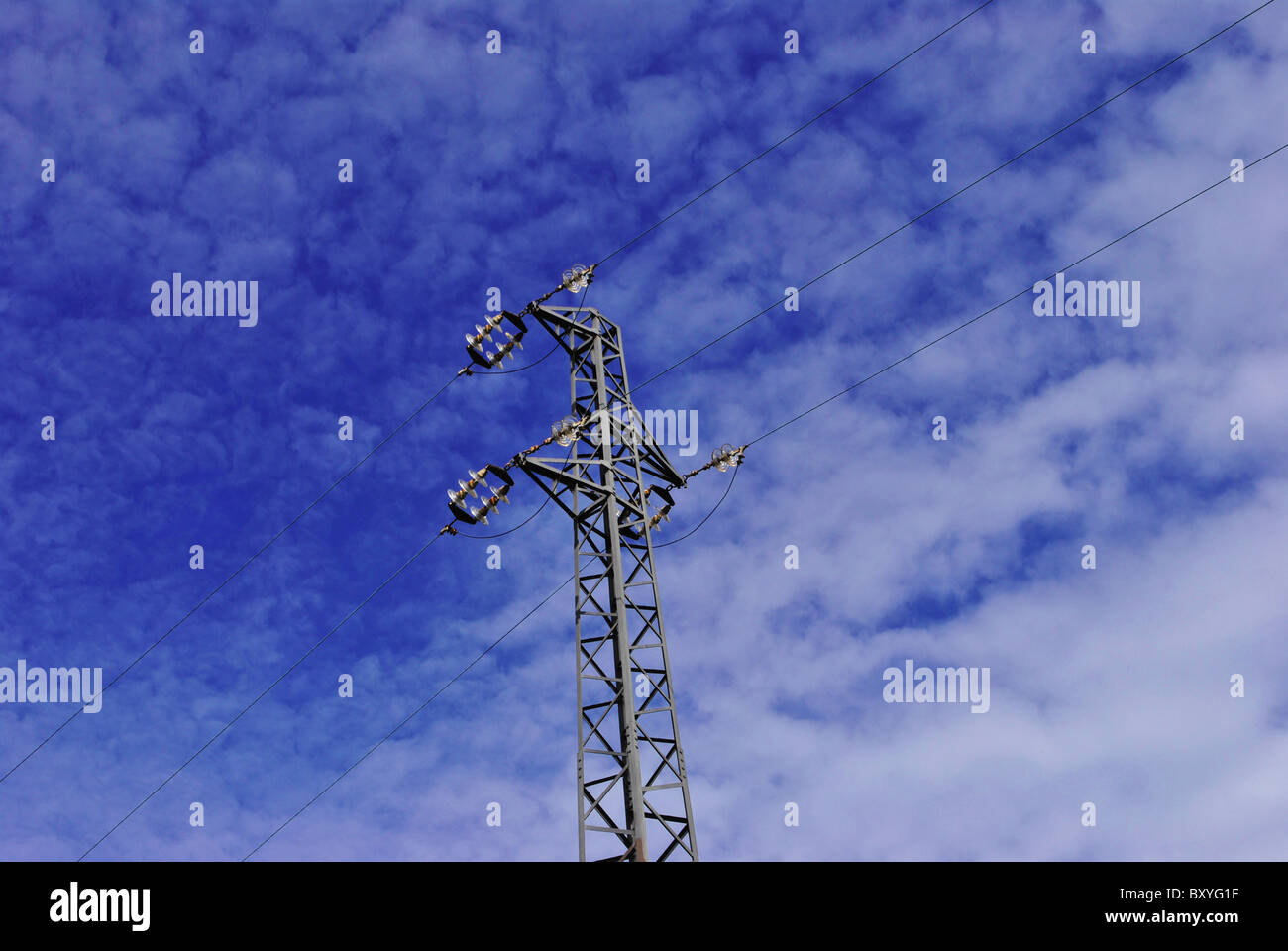 high voltage line and wires with blue sky with white clouds background ...