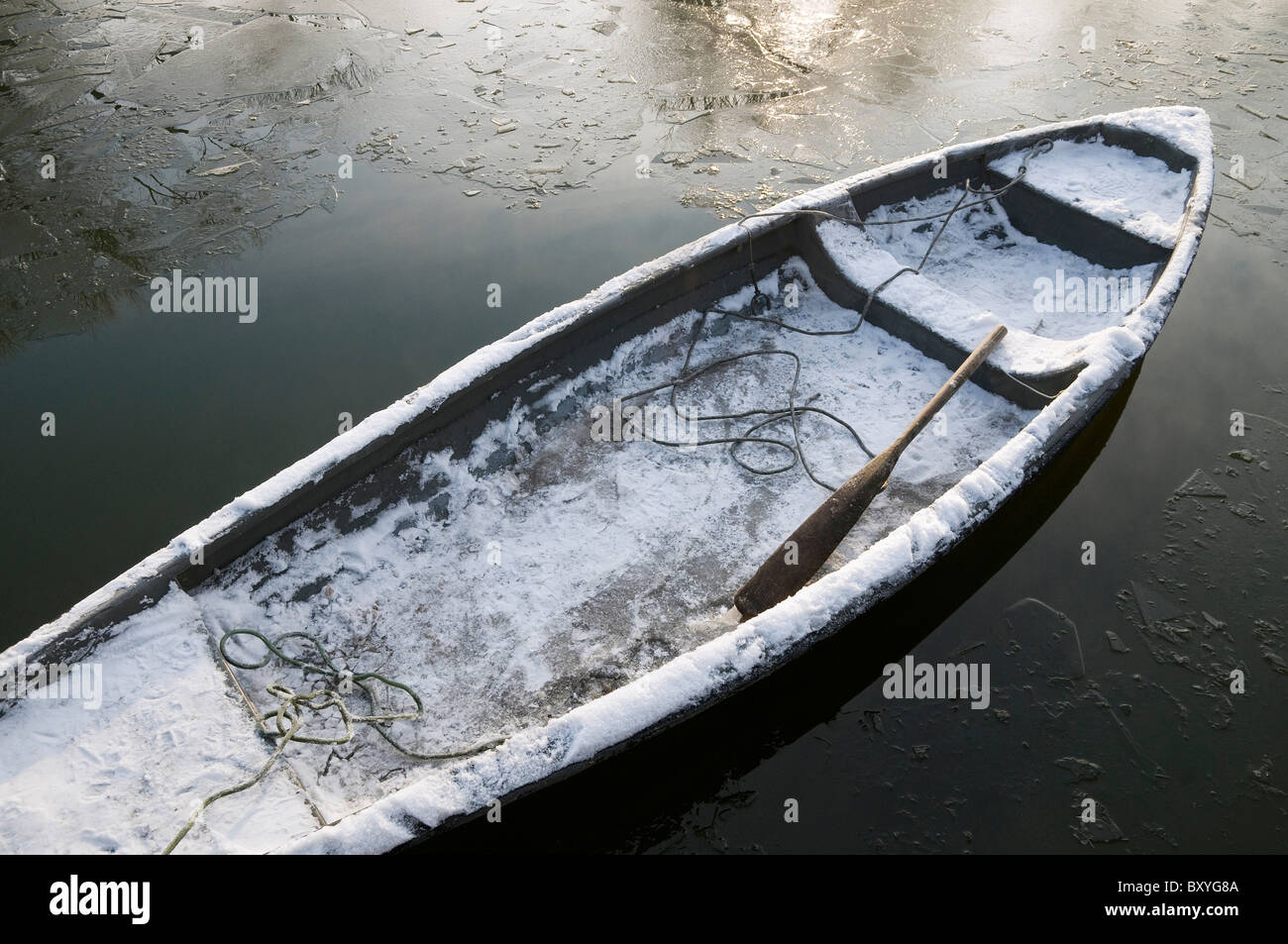 snow covered rowing boat, norfolk broads, england Stock Photo Alamy