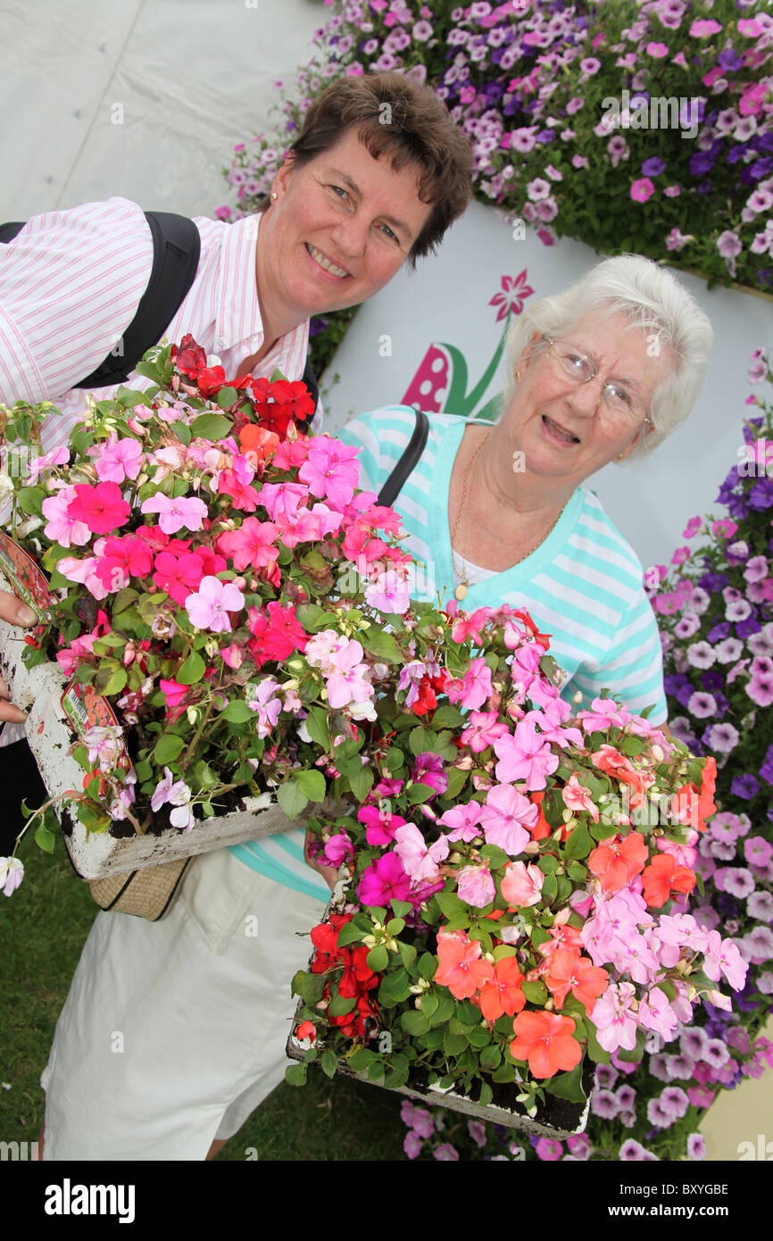 RHS Tatton, Cheshire. Mother and daughter buying plants during the plant madness event at the end of RHS Tatton. Stock Photo