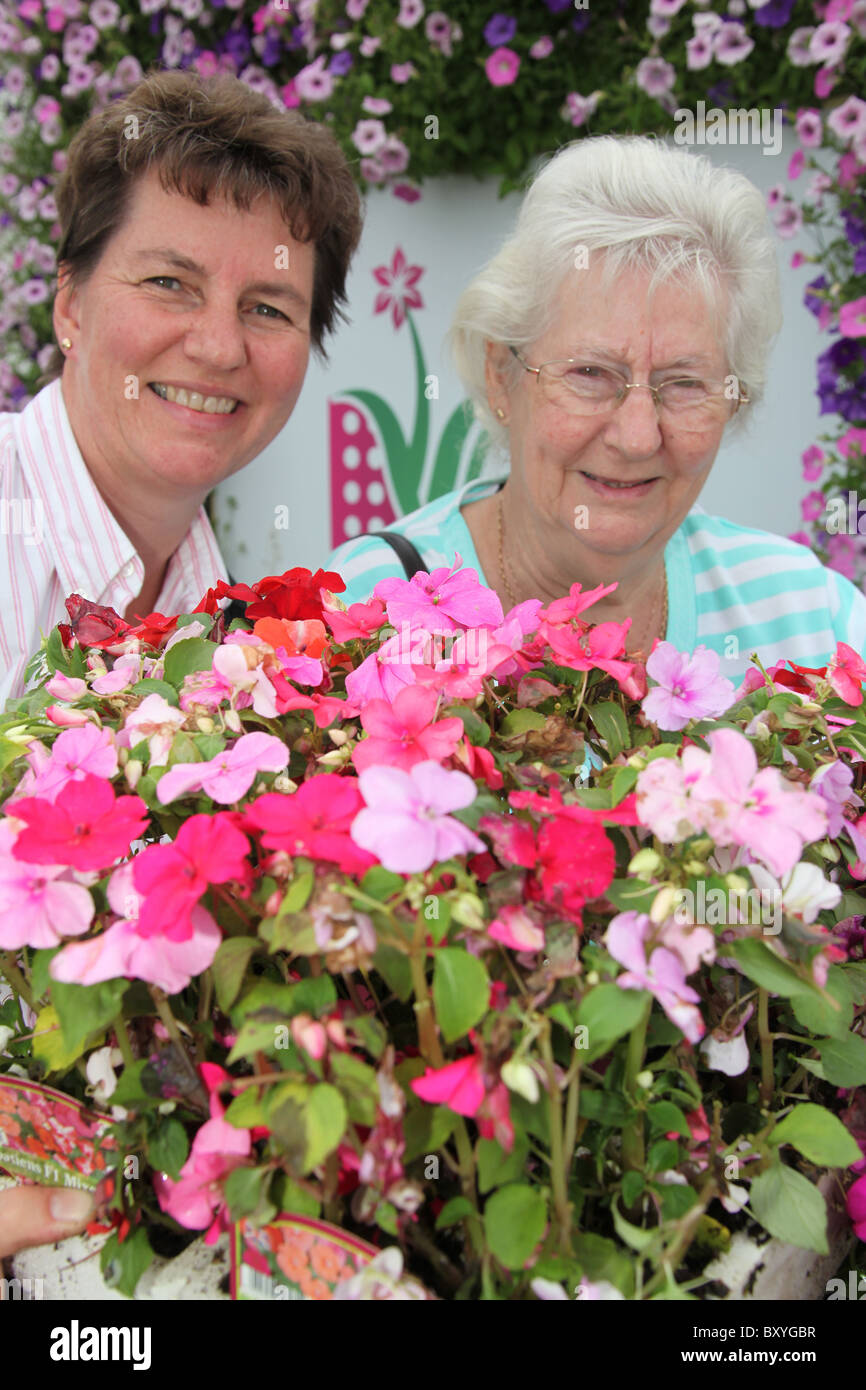 RHS Tatton, Cheshire. Mother and daughter buying plants during the plant madness event at the end of RHS Tatton. Stock Photo