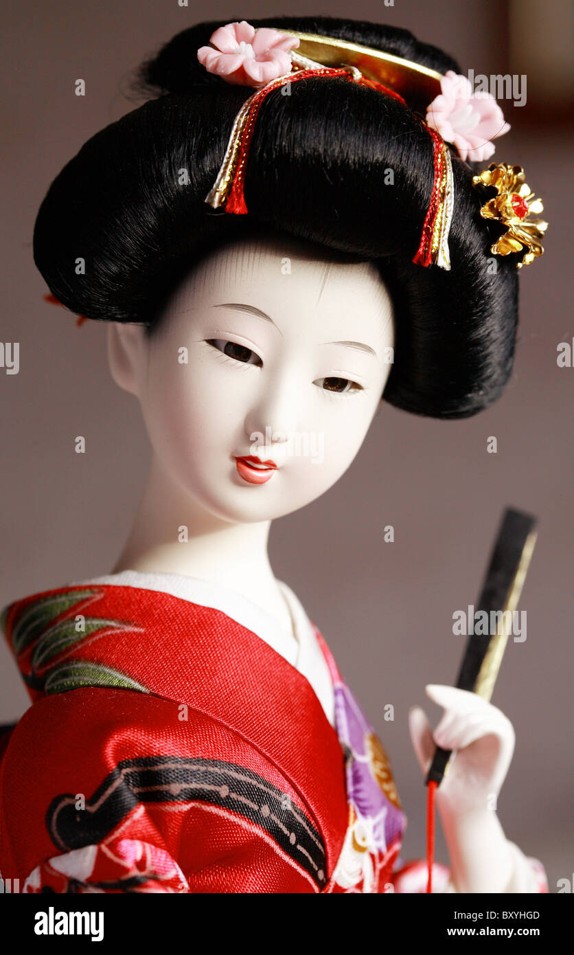 Close-up portrait of Japanese geisha doll in traditional costume ...