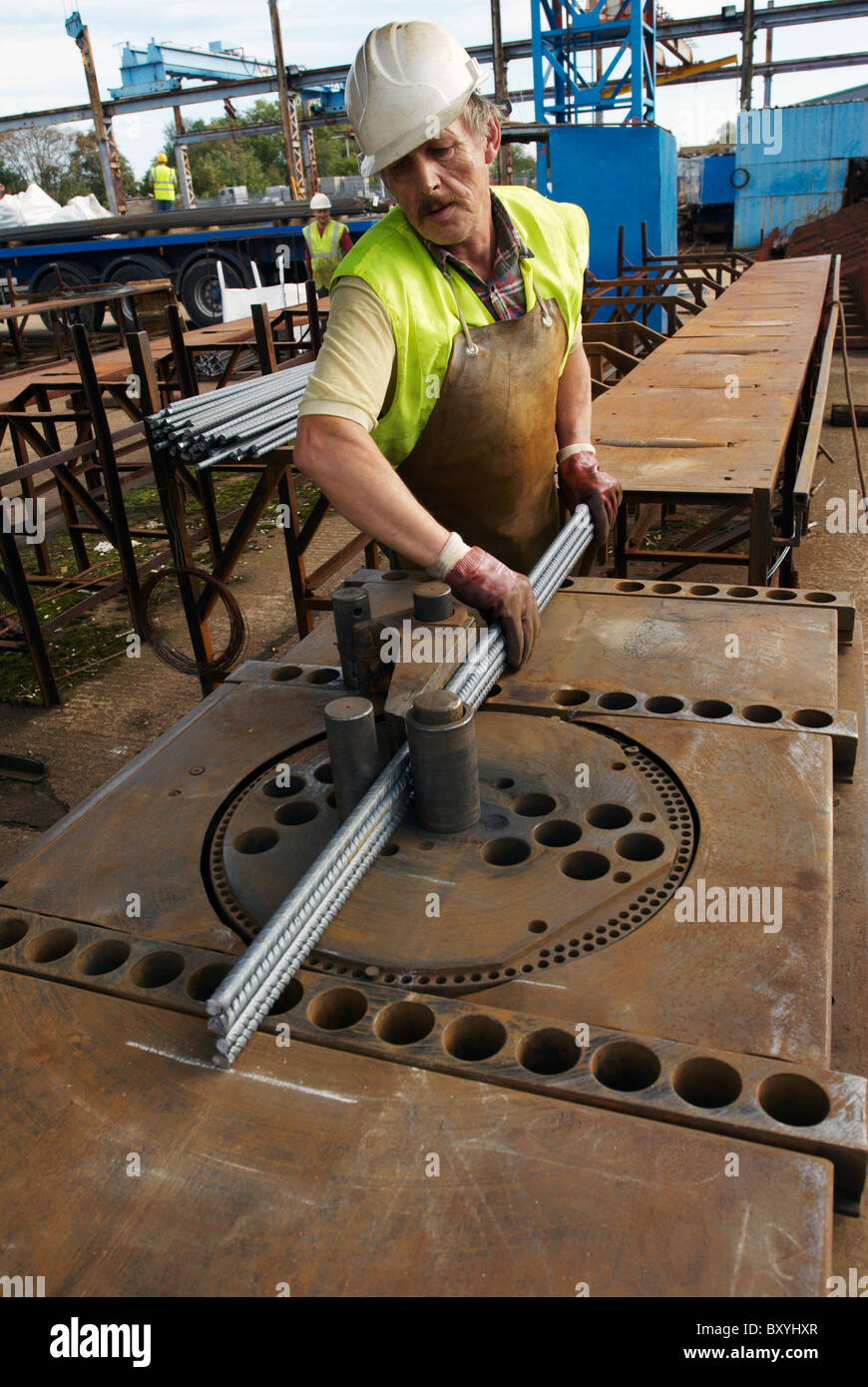 Concrete reinforcement steel rebar cut and bent factory. Worker