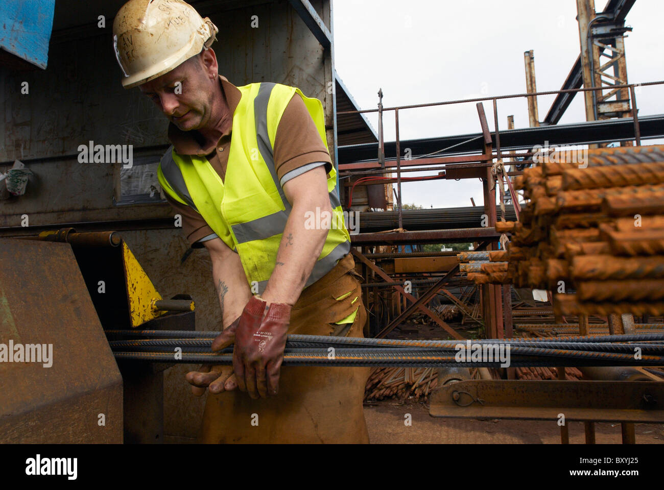 Concrete reinforcement steel rebar cut and bent factory. Worker