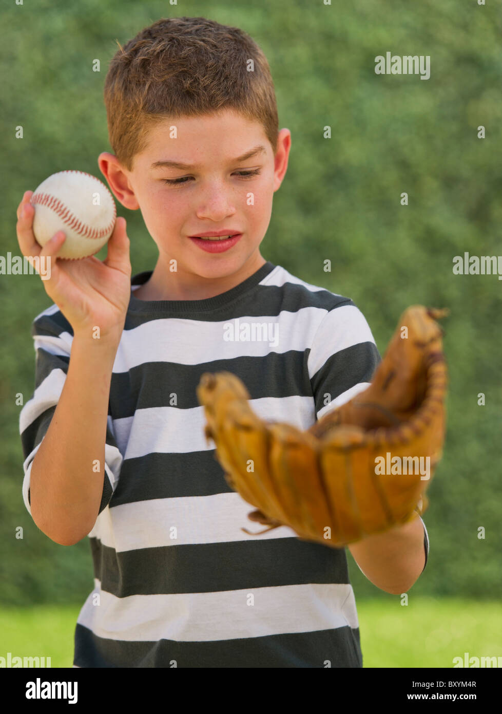 Boy holding baseball and baseball glove Stock Photo Alamy