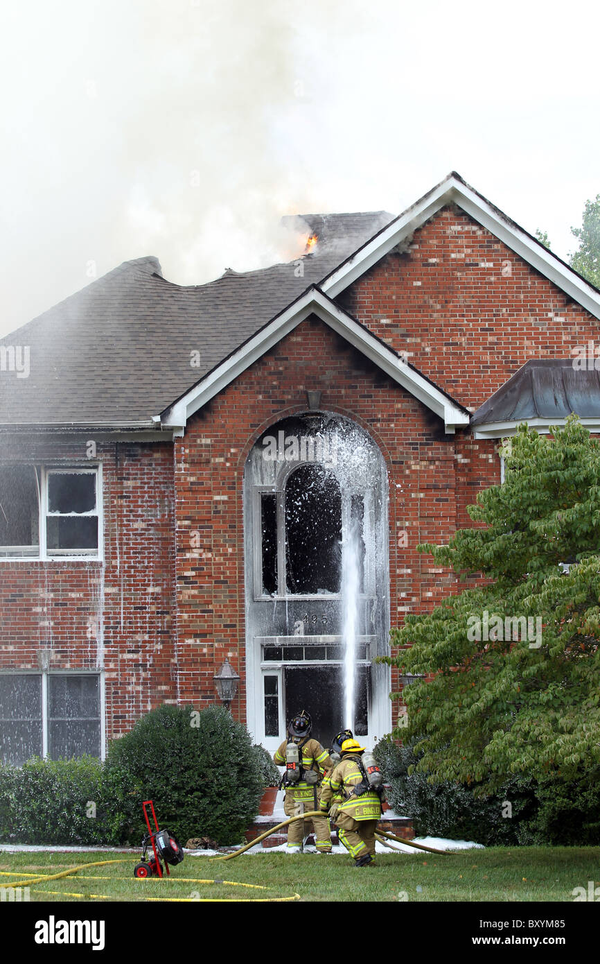 Firefighters work together to put out a house fire in Charlottesville ...