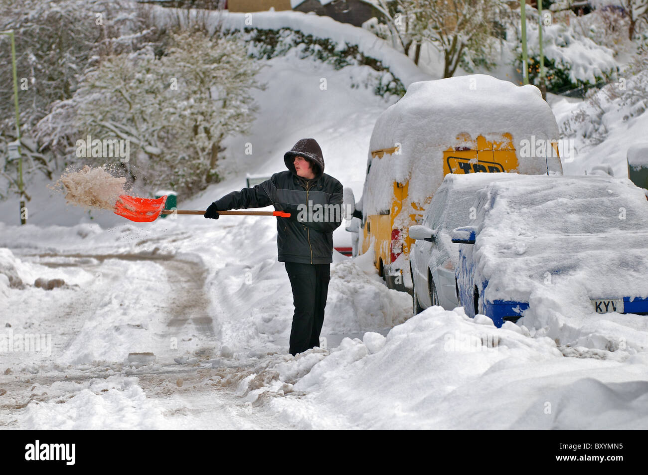 People trying to clear away the snow in the Scottish city of perth. Stock Photo