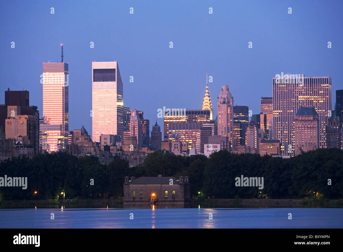 Skyline with Bloomberg Building and Chrysler Building at dusk, view from Central Park Stock Photo