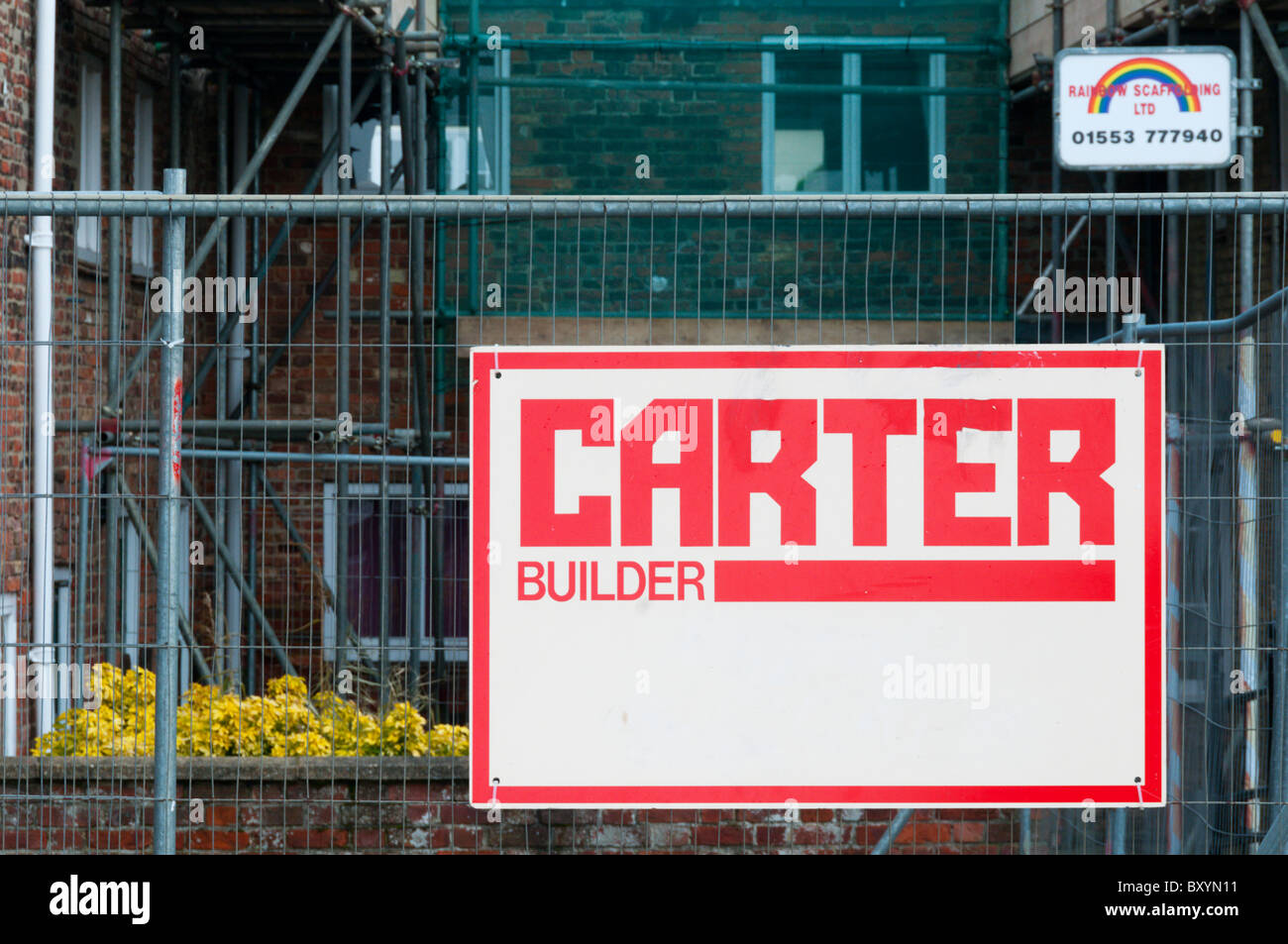 A builder's sign for 'Carter Builder' on a building site. Stock Photo