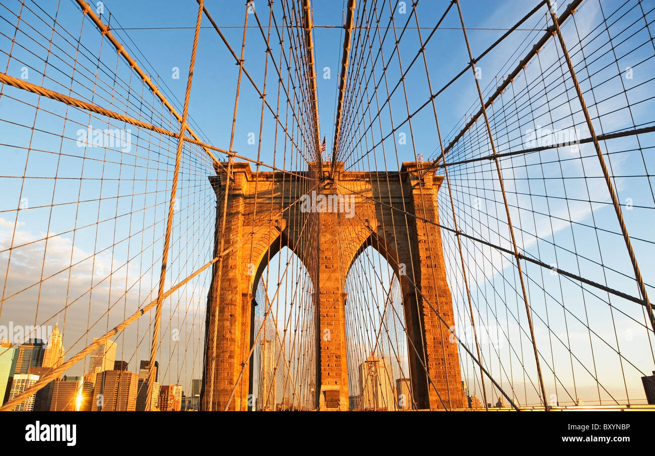 Span of Brooklyn Bridge, Manhattan skyline in background Stock Photo