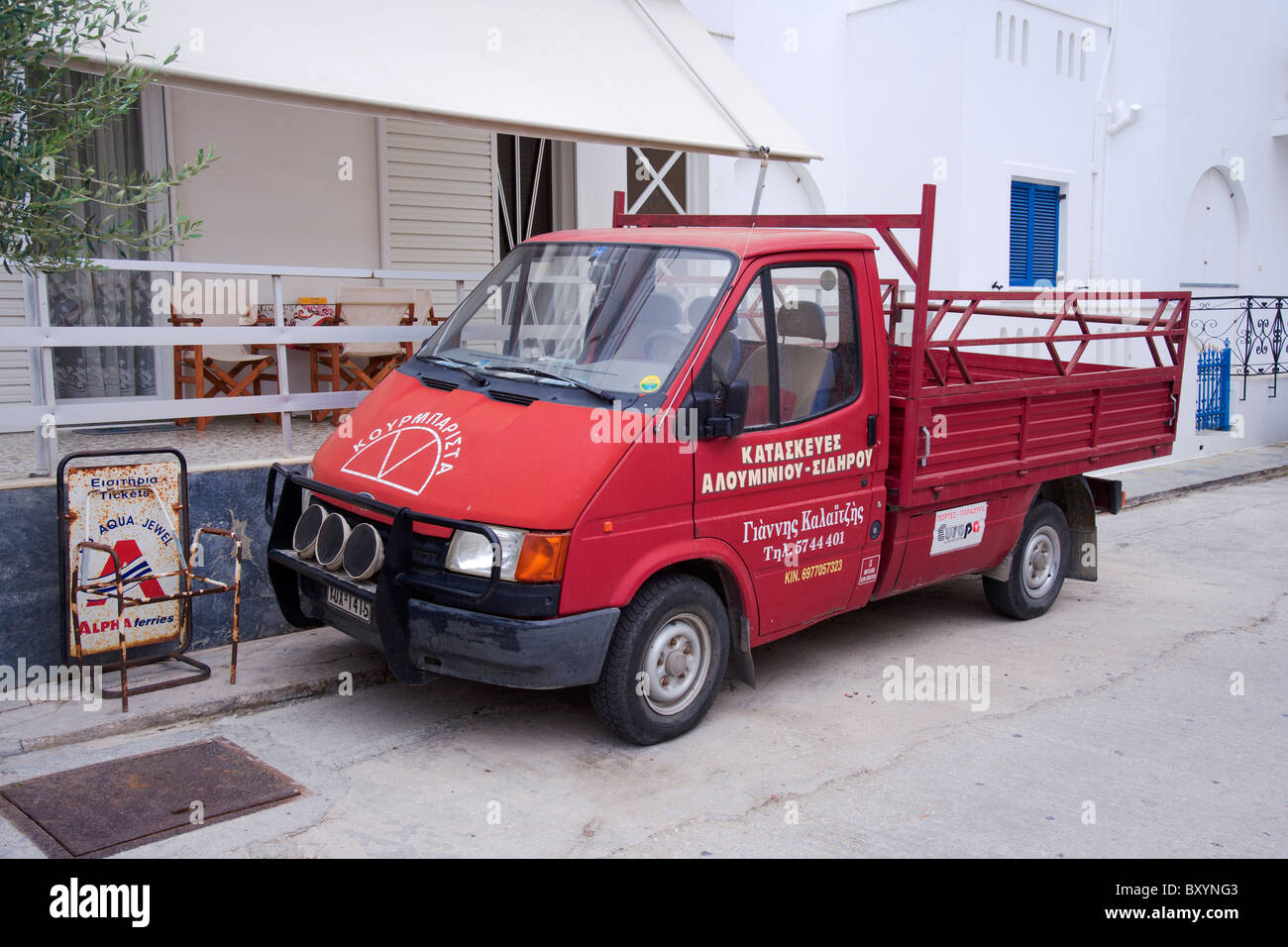 Commercial truck parked on a residential street in Parikia, on the Greek Cyclade island of Paros. Stock Photo