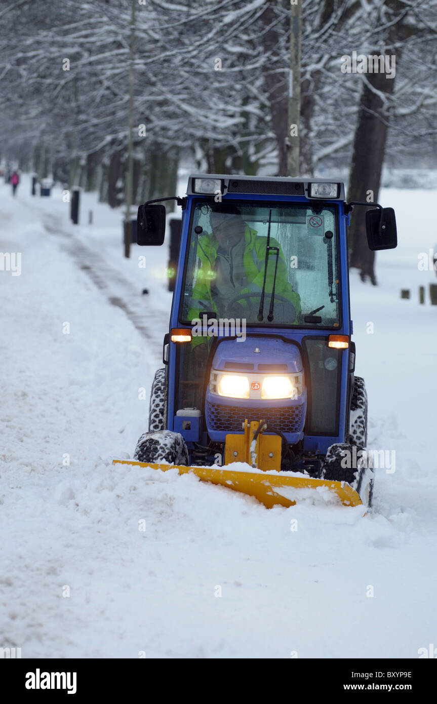 Snowplough clears the road after heavy snowfall Stock Photo