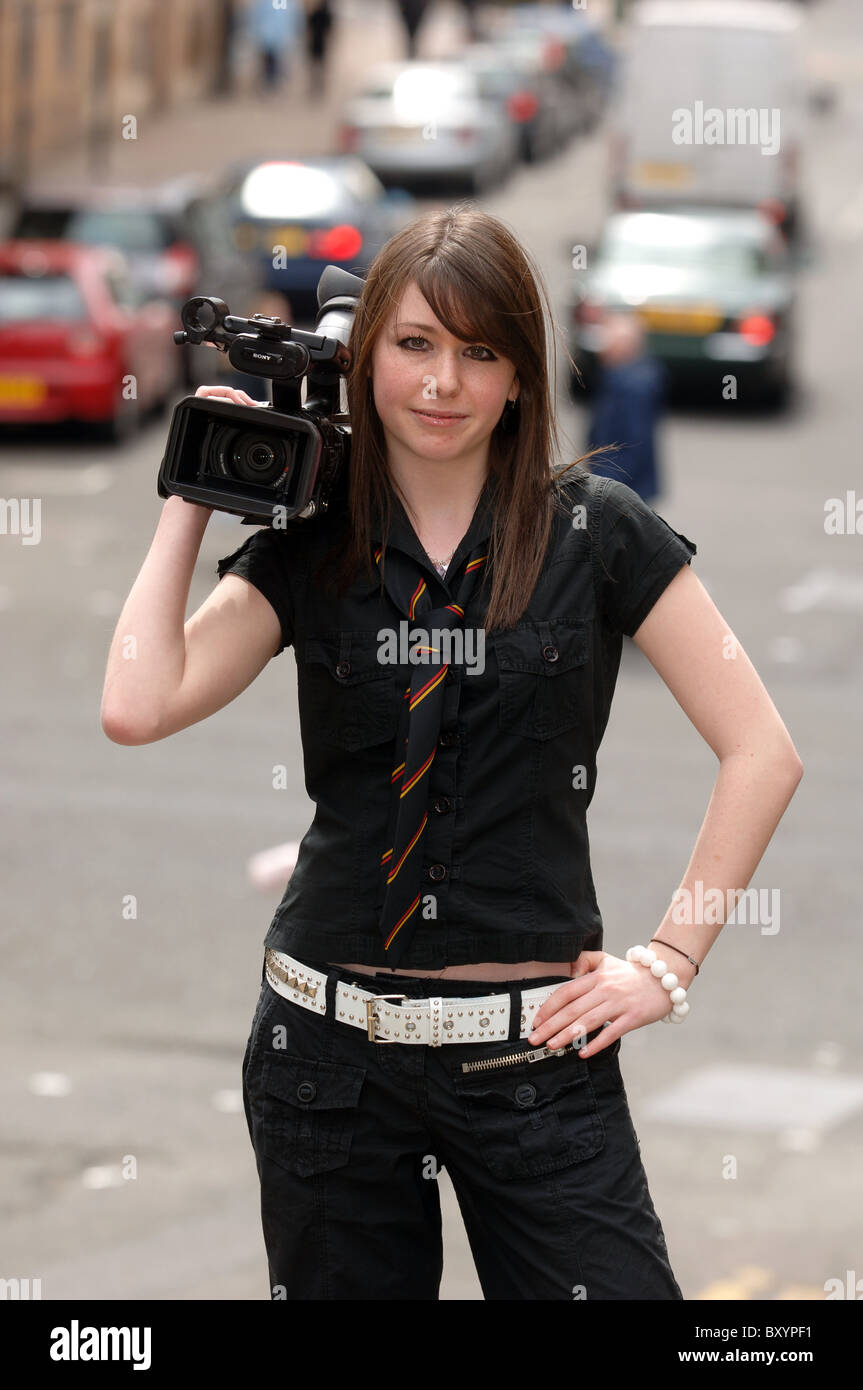 16-17 year old female filmaker on location Stock Photo