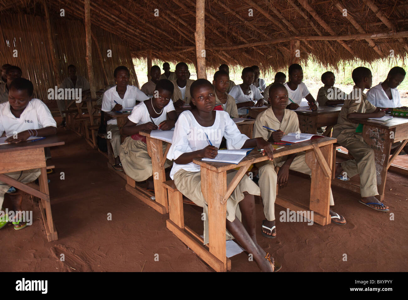 Students in an African village study during a typical school day Stock