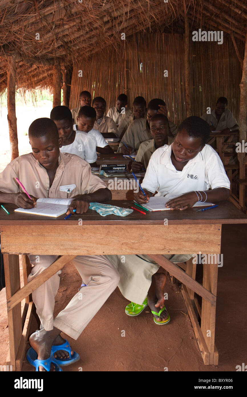 Students in an African village study during a typical school day Stock Photo