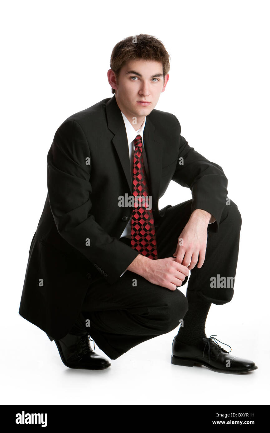 Handsome male in suit kneeling hi-res stock photography and images - Alamy