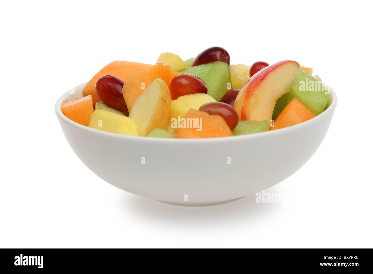 Bowl of fresh fruit on white background Stock Photo