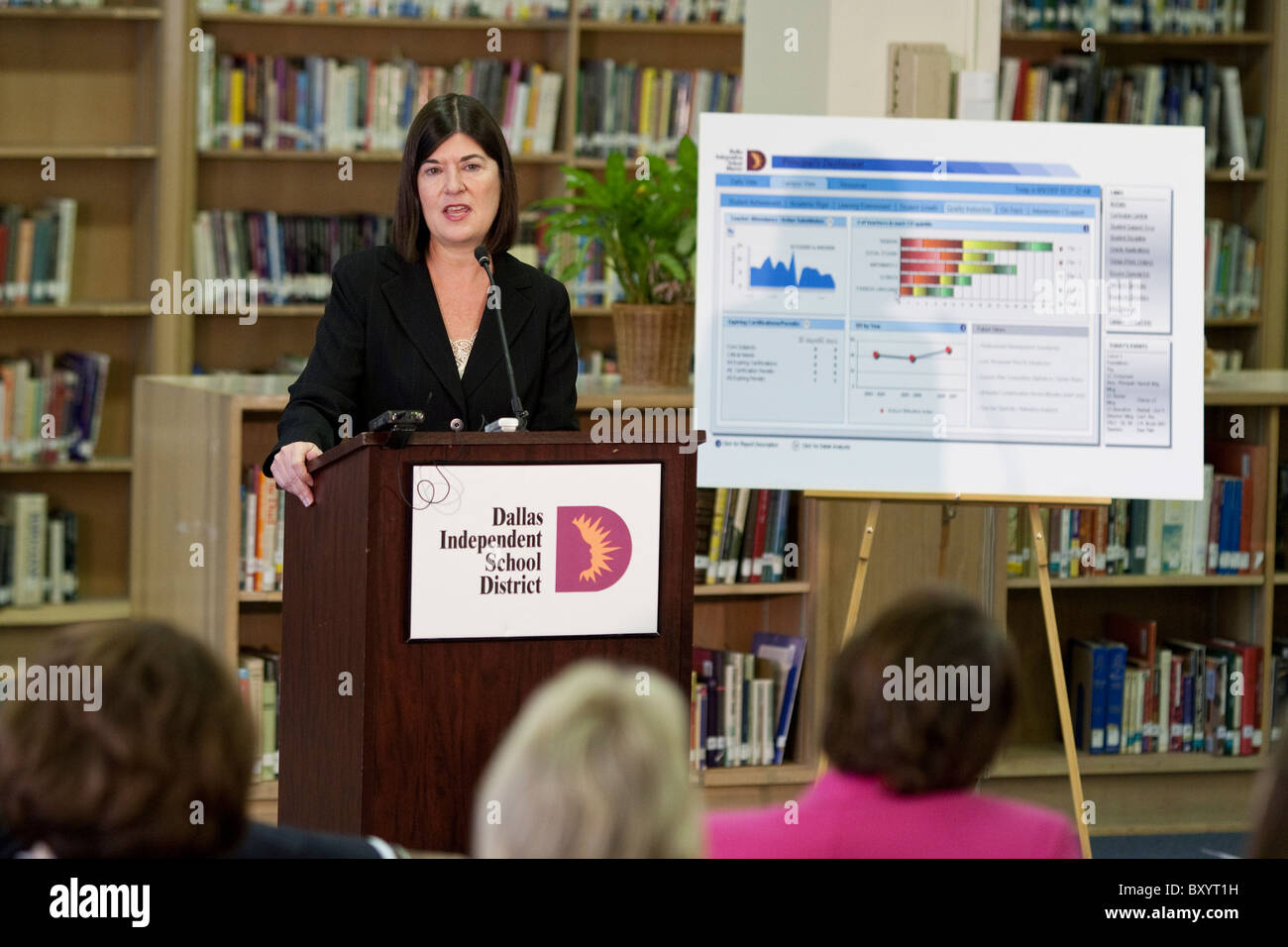 Professional woman makes presentation during press conference at public school library in Dallas, Texas Stock Photo